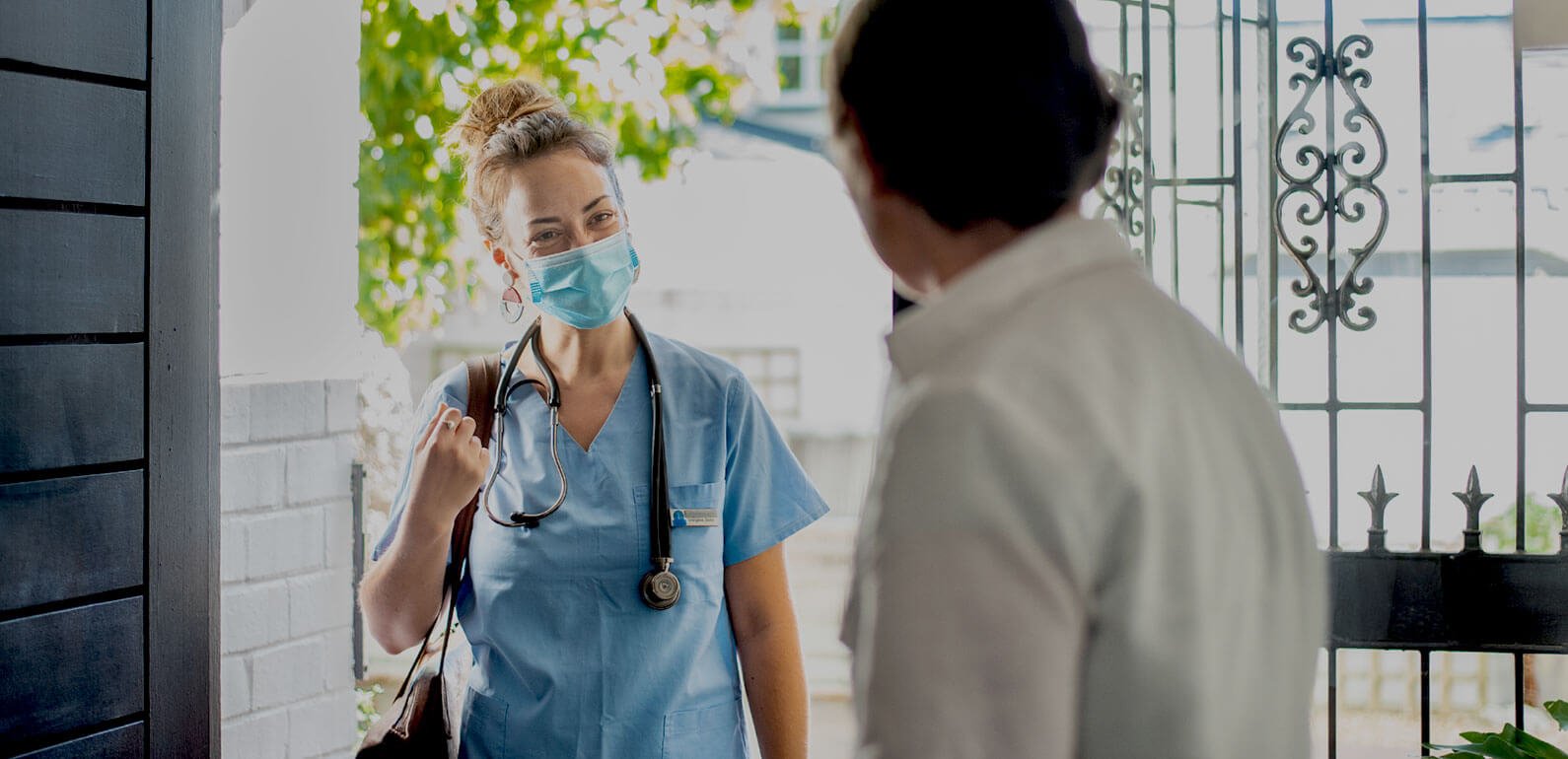 Healthcare worker arriving at the front door