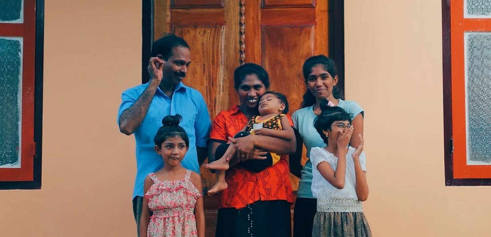 Sri Lankan family of 6 outside a house